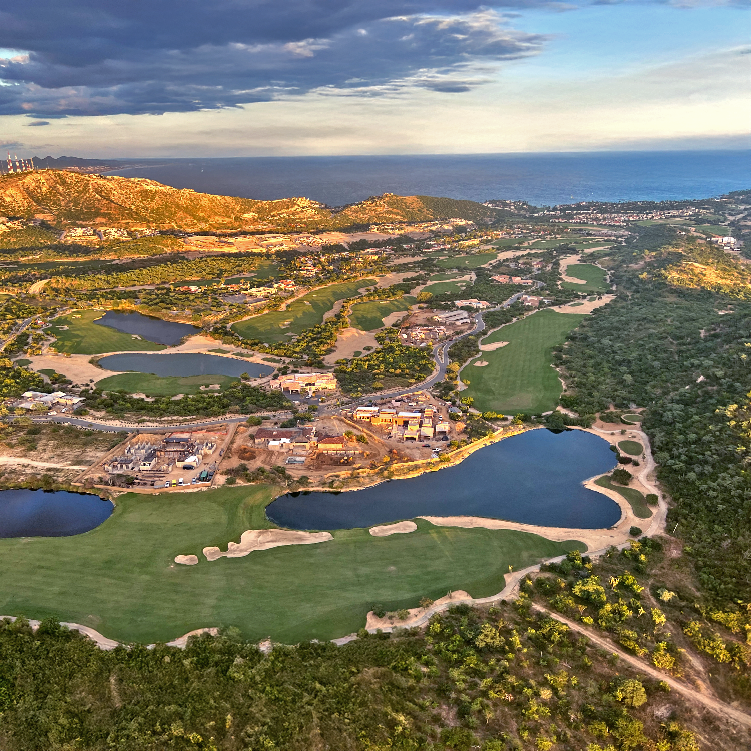 Baja Air luxury helicopter flying over Los Cabos at sunset